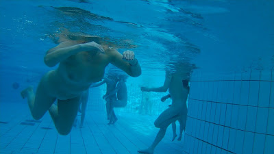 Underwater scenes of the nude chicks in the sauna pool