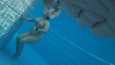 Underwater scenes of the nude chicks in the sauna pool